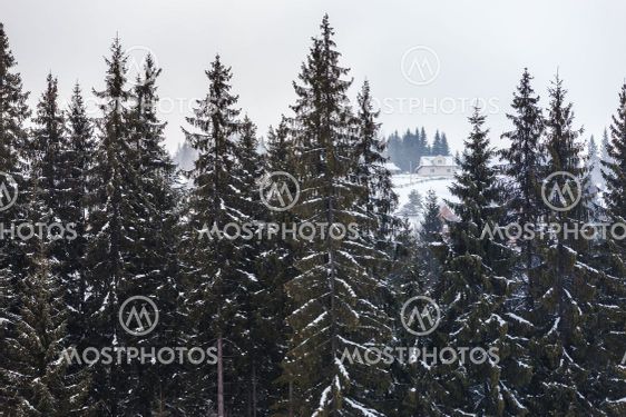 Snow-covered house in the mountains