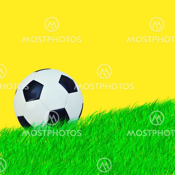 Ball on green grass and yellow background
