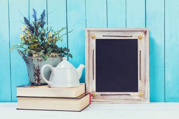 Wooden items of home decor close up on blue wooden...