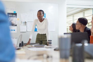 Presentation, meeting and businesswoman in office with...