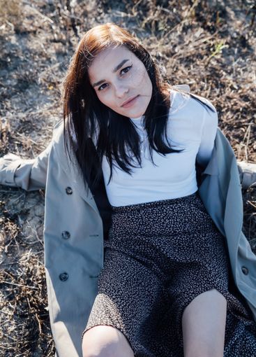 Beautiful fashionable brunette woman in gray coat...