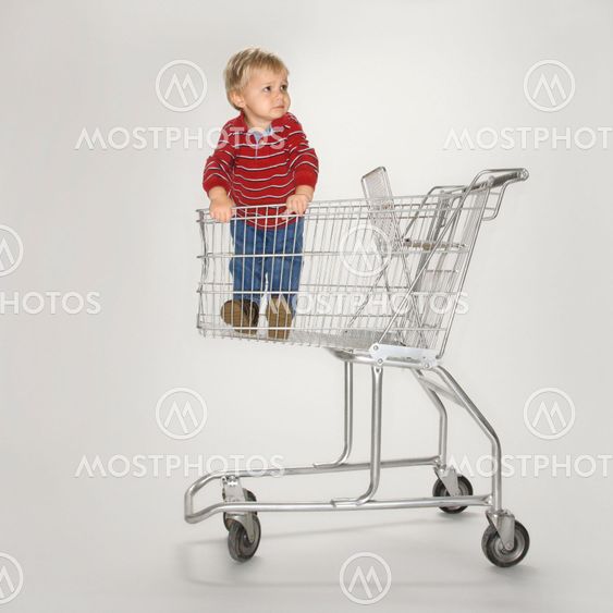 Boy in empty cart.