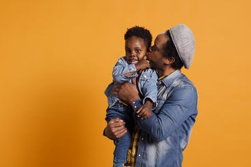 African american father and cute toddler having fun...