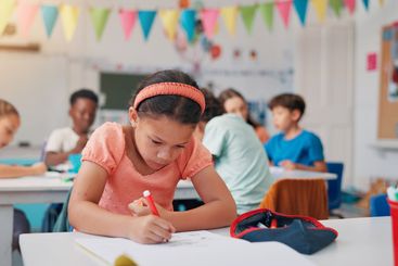 Notebook, learning and writing with girl in classroom...