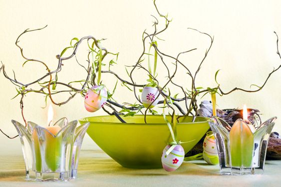 Easter decoration with green bowl and candles