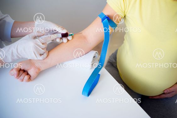 Doctor vaccinating a pregnant woman