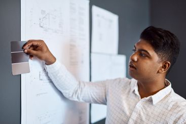 Project, architect and man with choice, color and...