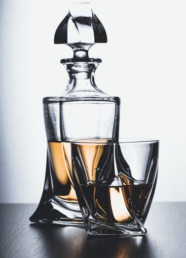 Strong alcoholic drink in glass close up