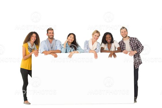 Smiling group of young friends leaning on large poster
