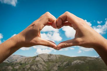 Female hands making a earth shape