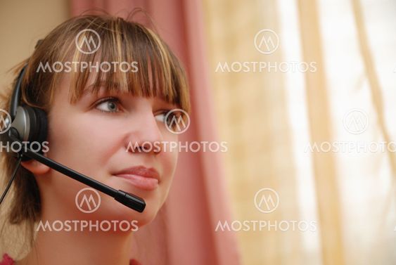 Smart young woman using head-set