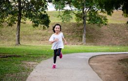Asian Little Chinese Girl running happily