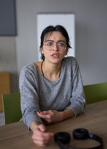 A close up portrait of a young businesswoman engaged in...