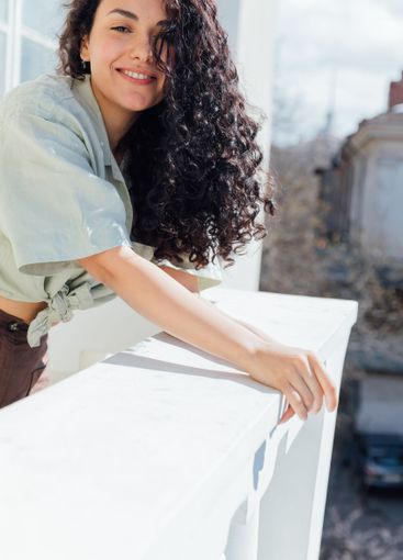 Beautiful slender brunette woman smiling sweetly