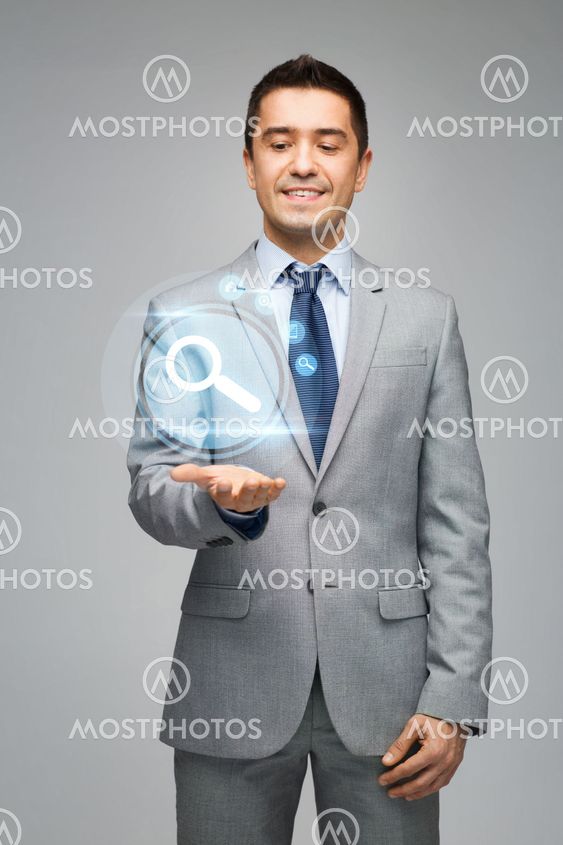 happy businessman showing virtual projection