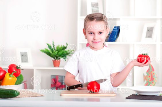 girl cooking vegetables
