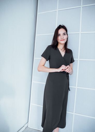 Beautiful Slim Woman in Green Summer Dress on White...