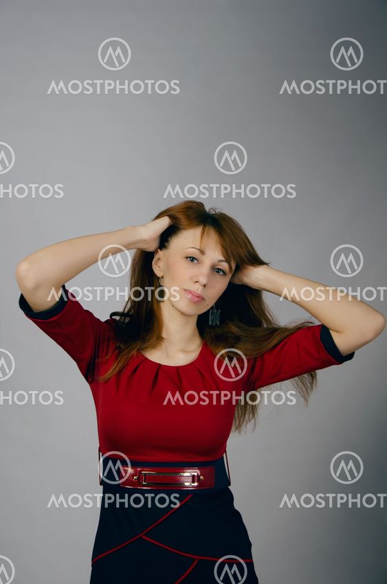 Beautiful young girl in a red dress