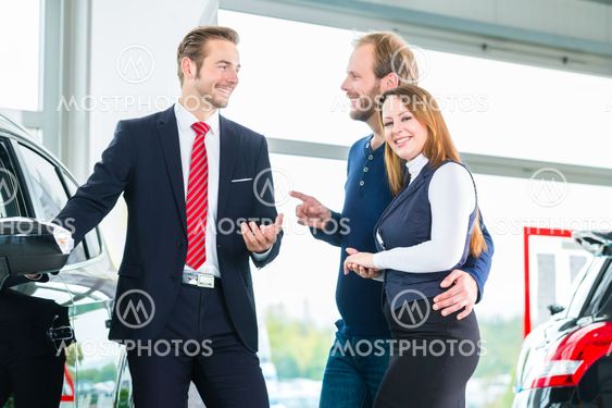 Dealer, clients and auto in car dealership