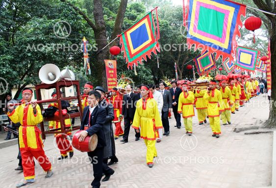 Group of people in traditional costume give gifts to the...