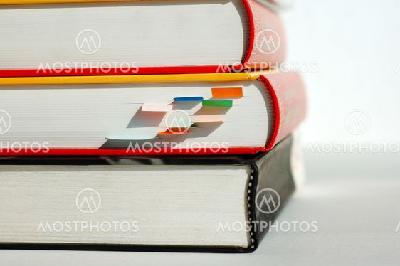 Three piled books