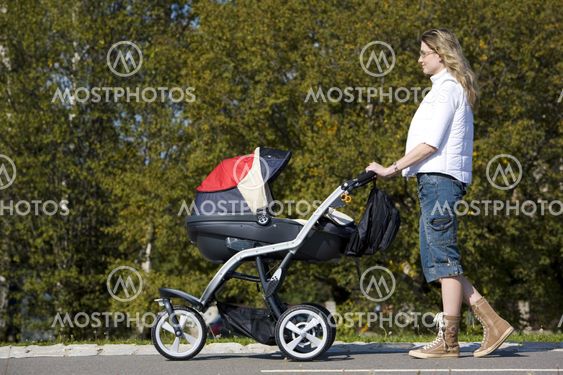 woman with pushing a pram
