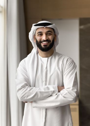 Entrepreneur dressed in traditional Arabic white kandora...