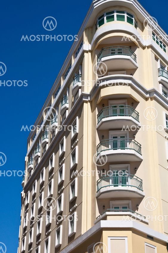 Yellow Angled Hotel Against a Blue Sky