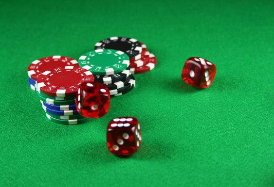 An Action shot of 5 dice thrown onto the table