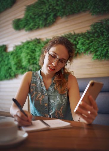 Cafe, freelance and businesswoman with smartphone for...
