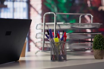 High end home office in a trendy loft apartment with an...