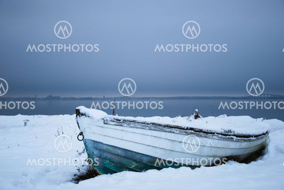Winter paused old rowboat