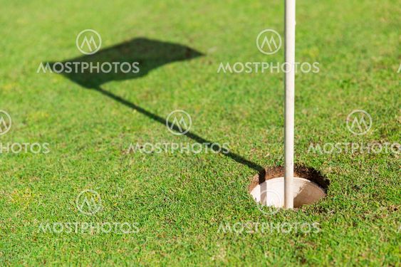 close up of flag mark in hole on golf field