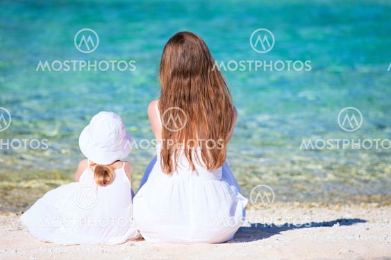 Mother and daughter on tropical beach