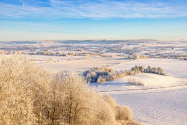 View at a beautiful rural winter landscape with snow and...