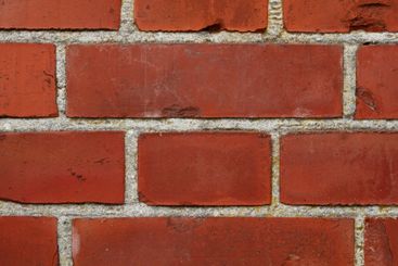 Closeup, brick wall or structure with concrete surface...
