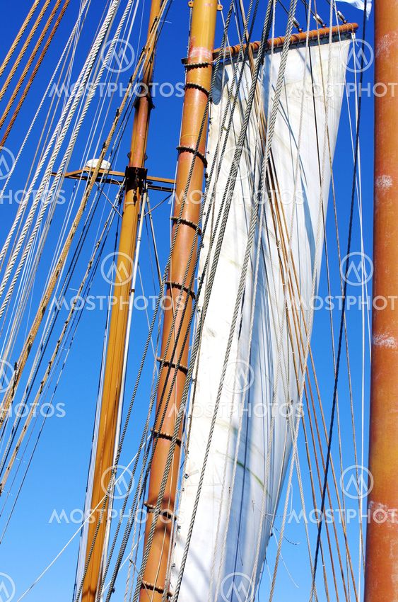 Old sailing ship masts and sails