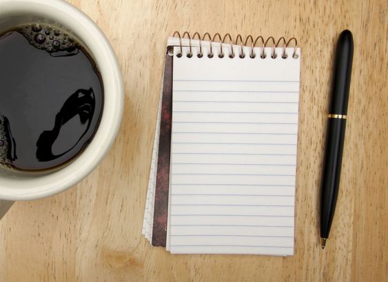 Note Pad Cup and Pen on Wood