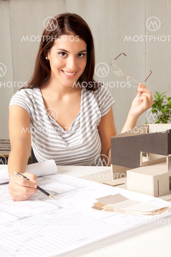 Architect with Blueprints and House Model