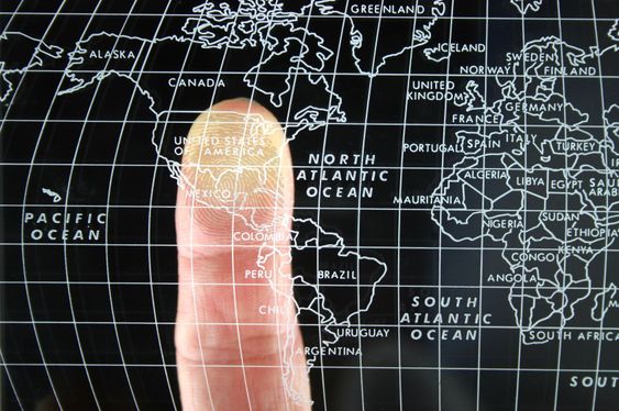 Finger on world Map