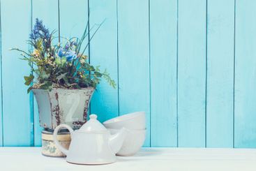 Shabby chic style home decorations on wooden background