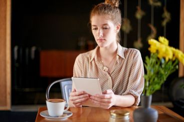 Coffee, remote work and tablet with woman in cafe for...