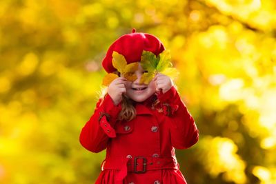 Little girl in autumn park