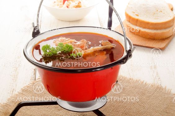 hungarian carp soup in a kettle and sour salad