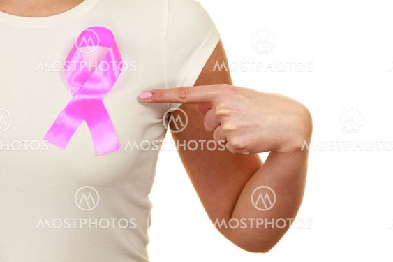 Closeup pink cancer ribbon on woman chest