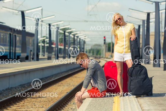 Young Couple Waiting at Train Station