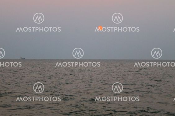 Full moon rising over the sea