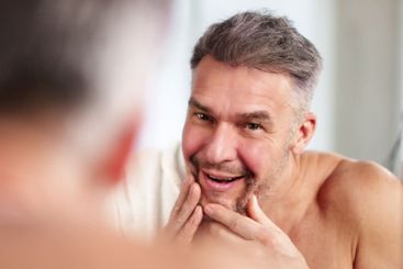 Close-up Of A Man Washing Face