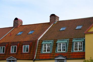 traditional european rooftops with red tiles.
