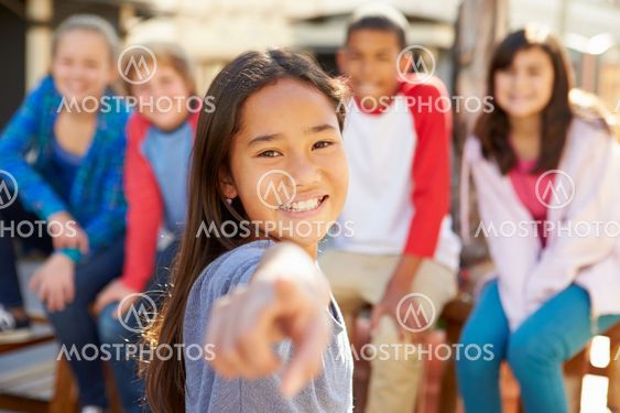Group Of Children Hanging Out Together In Mall